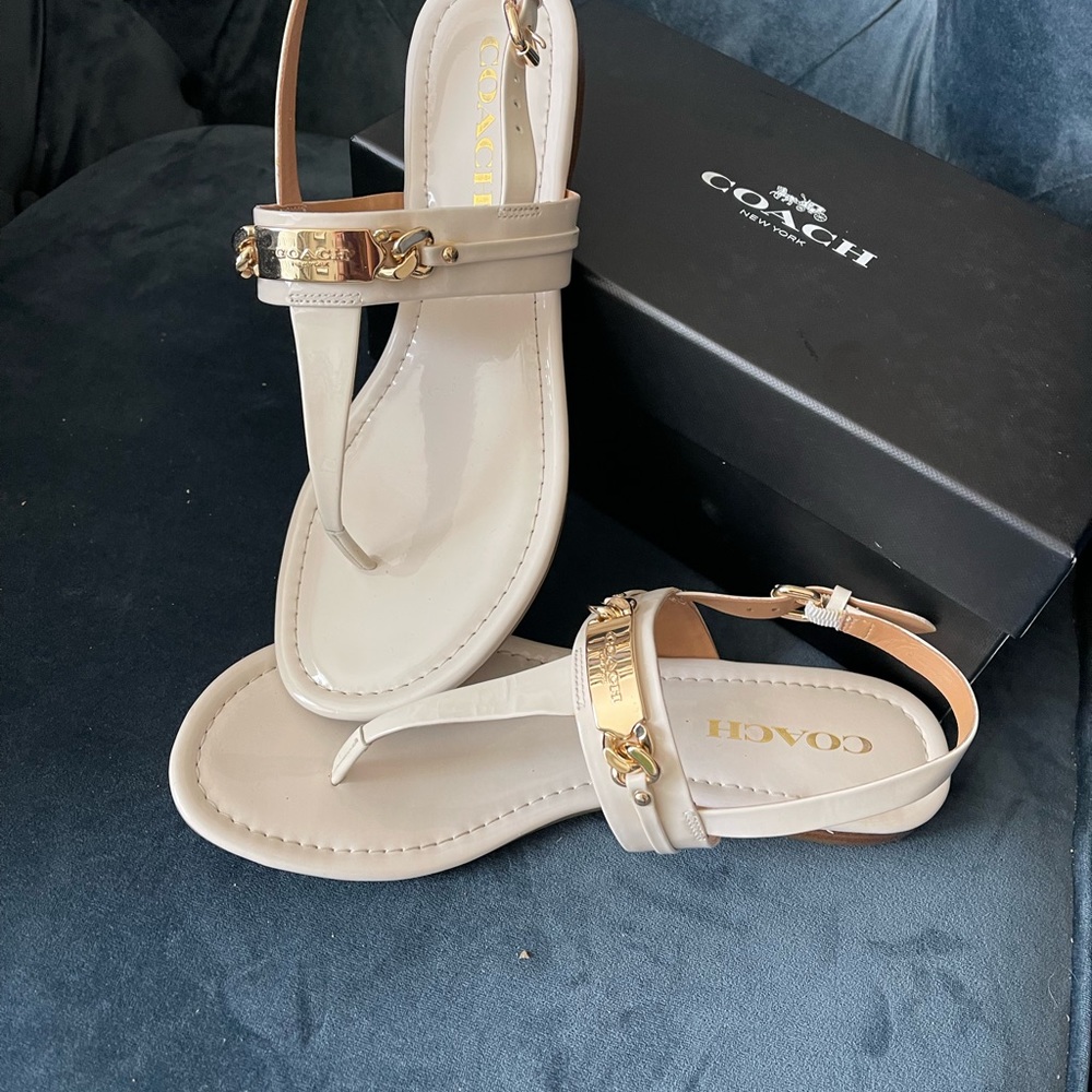 Luxurious Ivory COACH sandals with gold tone hardware